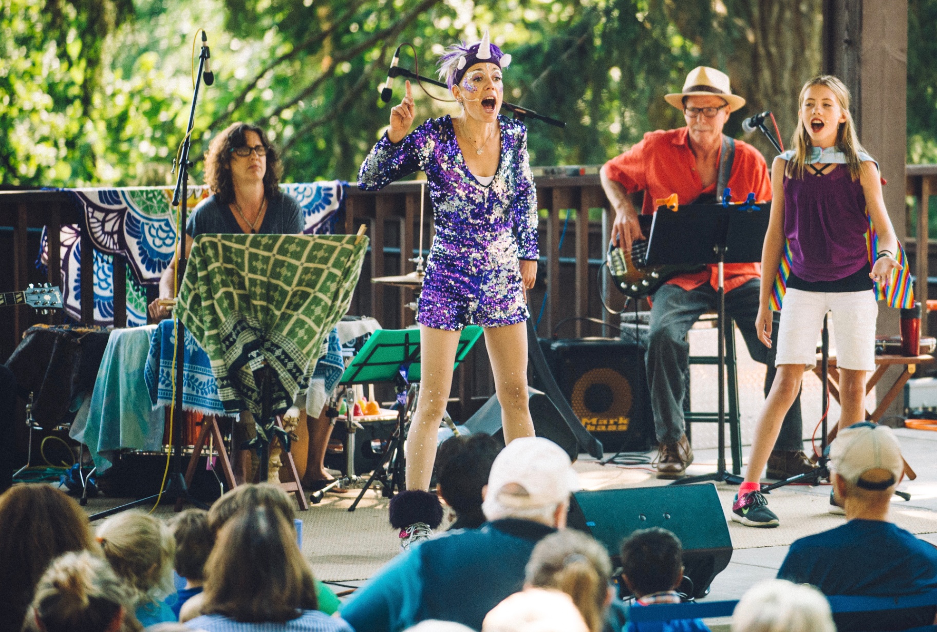 Jenifer as JenUwin performing on outdoor stage with band at Britt Music & Arts Festival