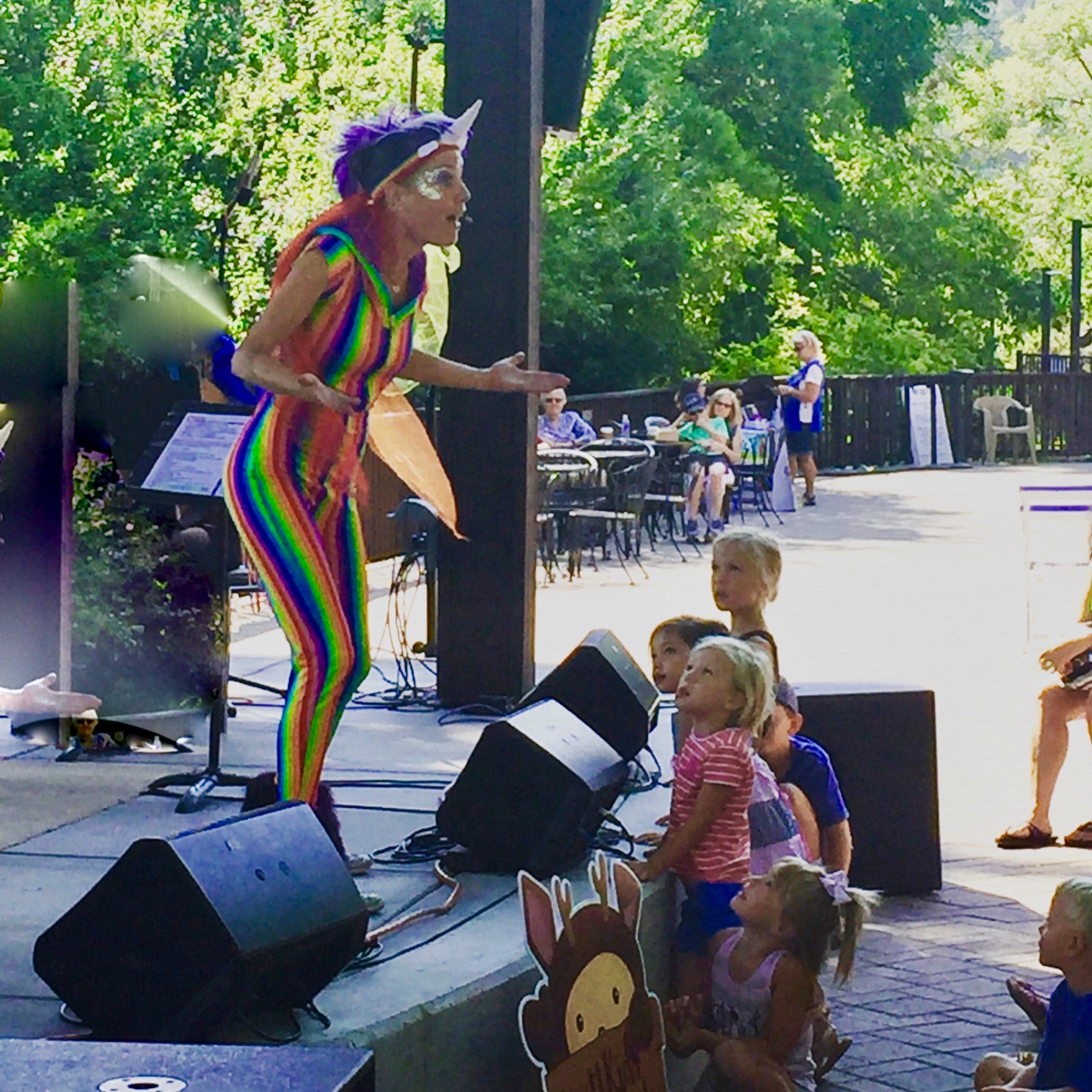 Jenifer engaging children at the edge of the stage during a Britt Festival show