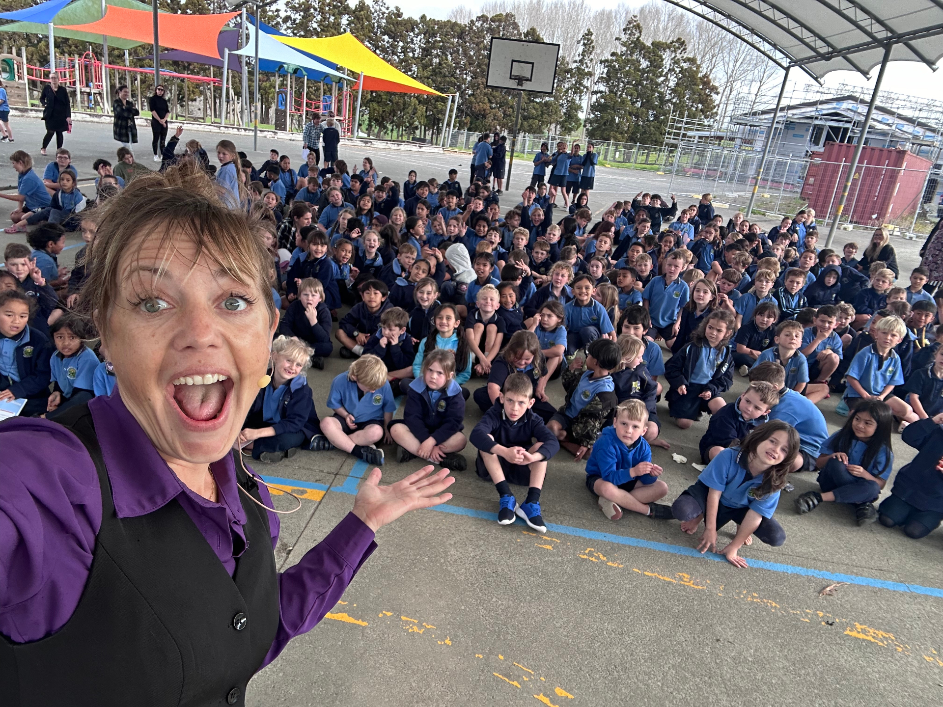 Jenifer performing The NED Show for students in New Zealand