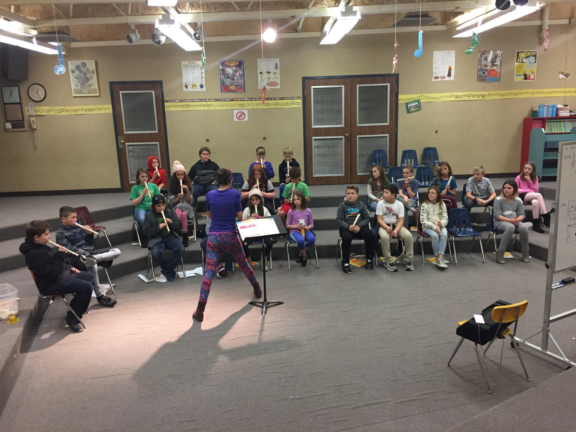 Jenifer conducting a recorder ensemble