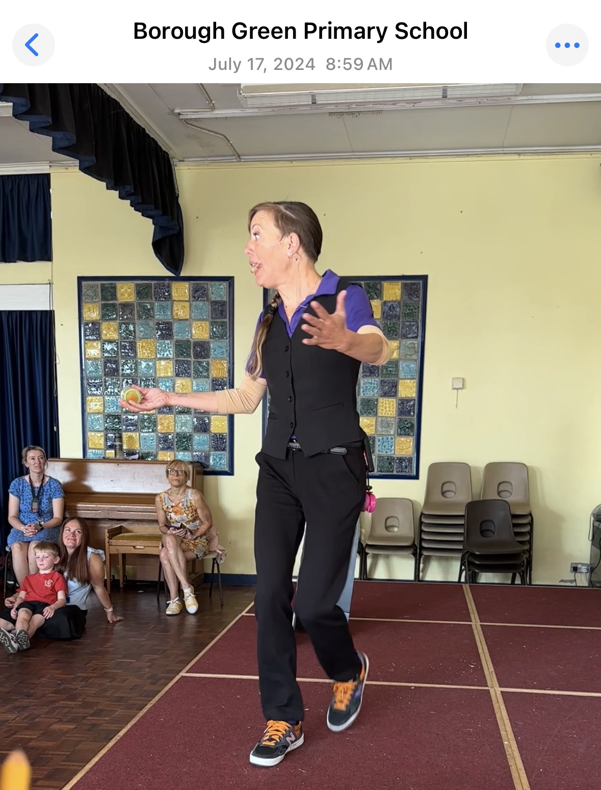 Jenifer performing yo-yo tricks during The NED Show at Borough Green Primary School in England